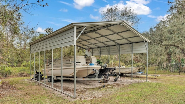 view of vehicle parking with a carport and a lawn