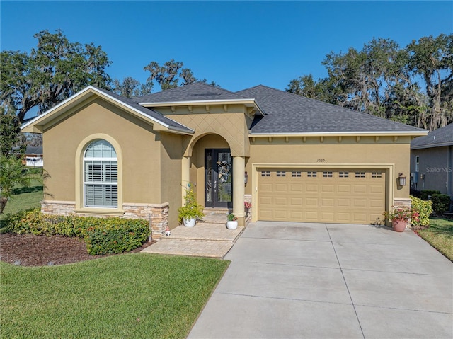 mediterranean / spanish-style house featuring a front lawn and a garage