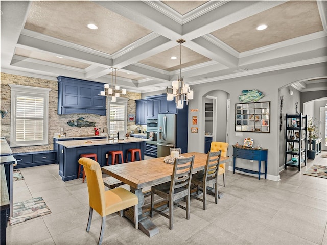 dining space featuring beamed ceiling, ornamental molding, and coffered ceiling