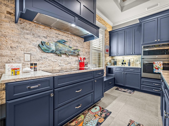 kitchen with stainless steel double oven, blue cabinets, black electric stovetop, and crown molding