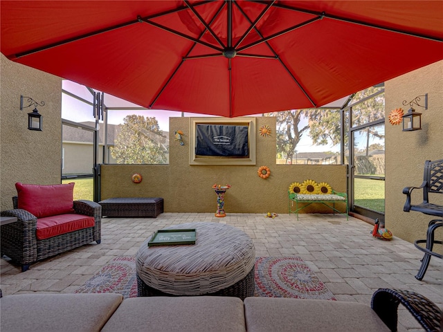 view of patio with a lanai