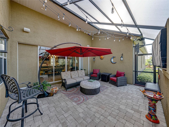 view of patio featuring a lanai and an outdoor living space