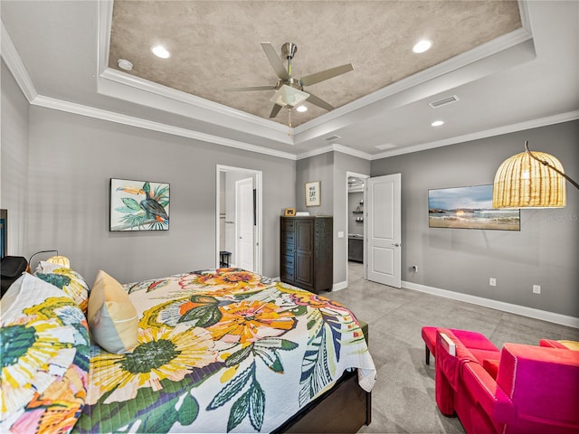 bedroom with ceiling fan, crown molding, and a tray ceiling