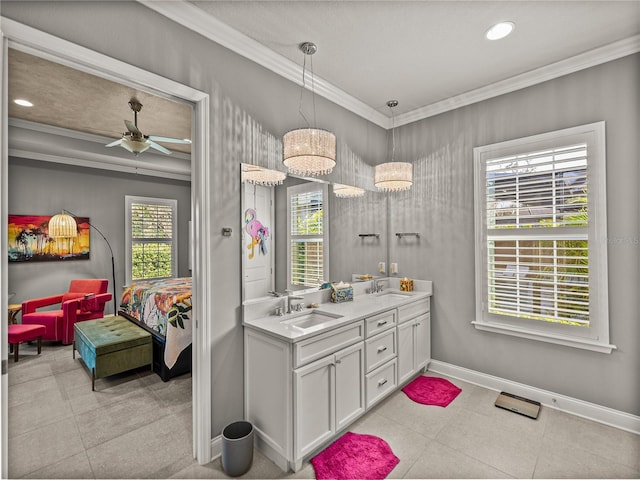 bathroom with ornamental molding, ceiling fan, and vanity