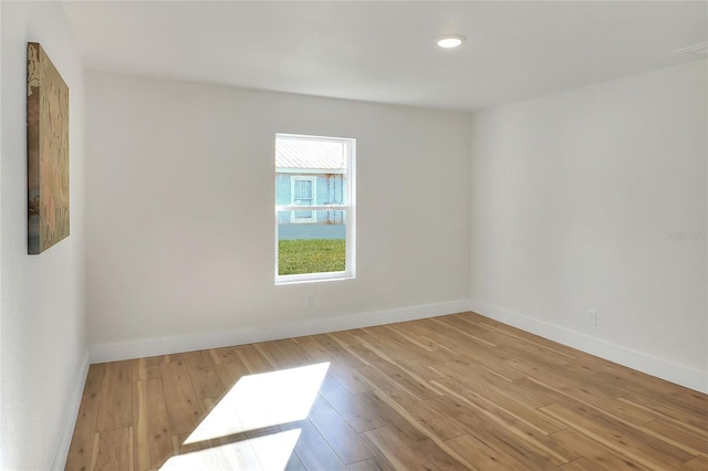 spare room with light wood-type flooring