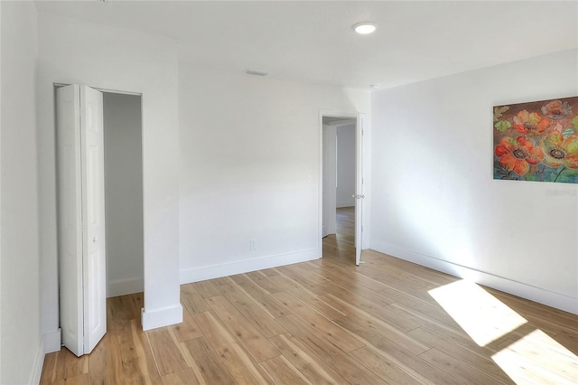 unfurnished bedroom featuring light hardwood / wood-style floors