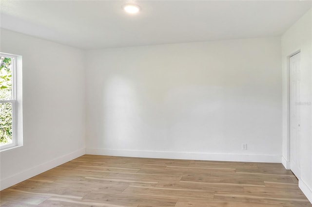 spare room featuring light wood-type flooring