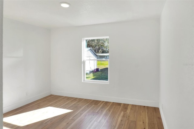 spare room with light hardwood / wood-style floors