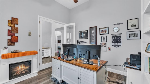 interior space with white cabinets, ceiling fan, and dark hardwood / wood-style flooring