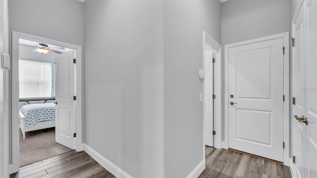 corridor featuring hardwood / wood-style floors