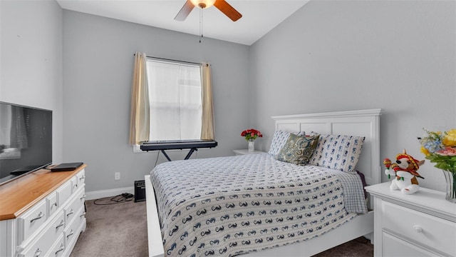 bedroom with dark colored carpet and ceiling fan