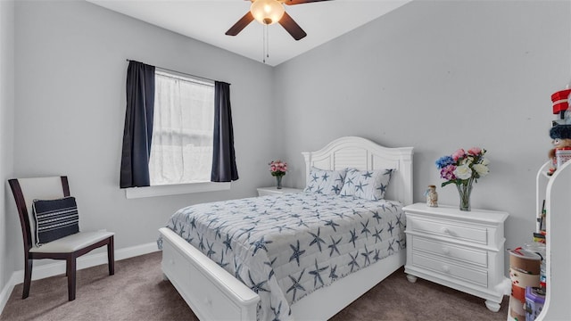 bedroom with ceiling fan and dark colored carpet