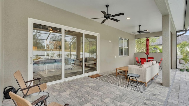 view of patio featuring ceiling fan