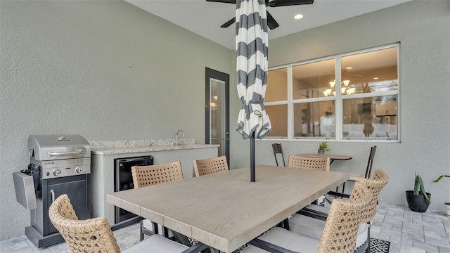 dining space featuring ceiling fan with notable chandelier