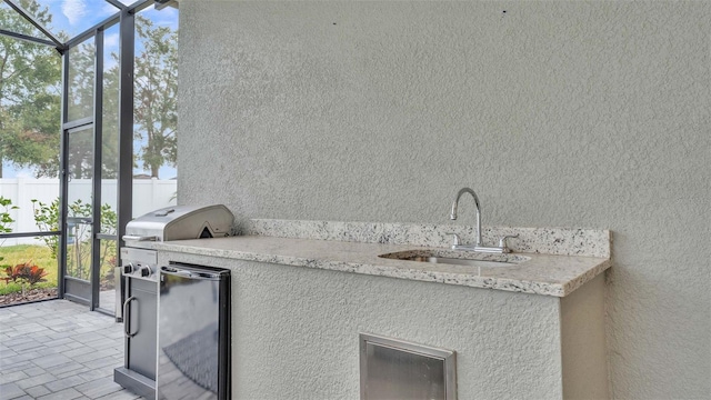 view of patio / terrace with sink and grilling area