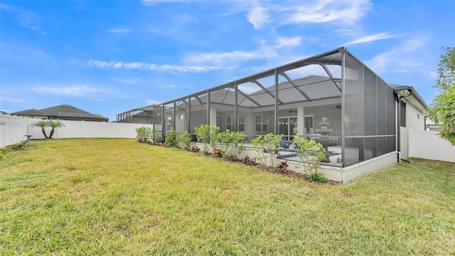 exterior space featuring a lanai and ceiling fan