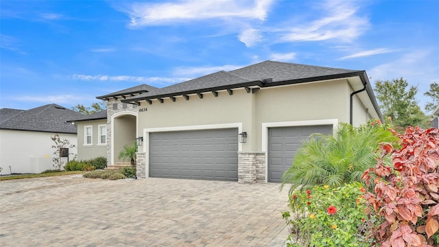 view of front of property with a garage