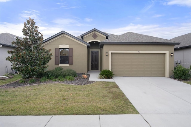 view of front of home featuring a garage and a front yard