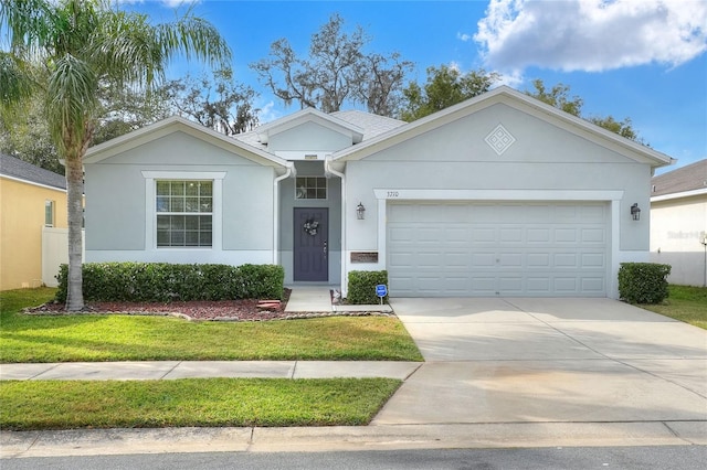 ranch-style house with a garage and a front yard