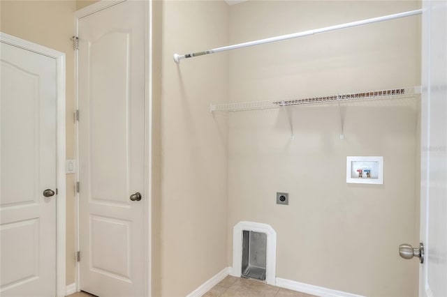 laundry area with hookup for a washing machine, light tile patterned floors, and electric dryer hookup