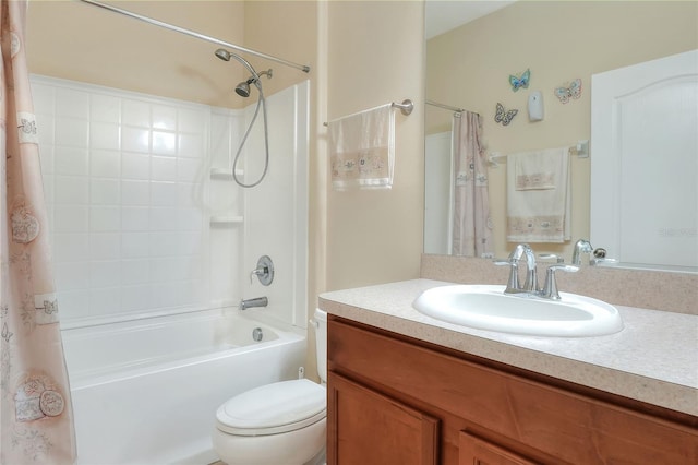 full bathroom with shower / bath combo with shower curtain, vanity, and toilet