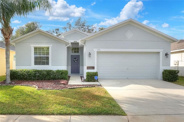 ranch-style home with a front yard and a garage