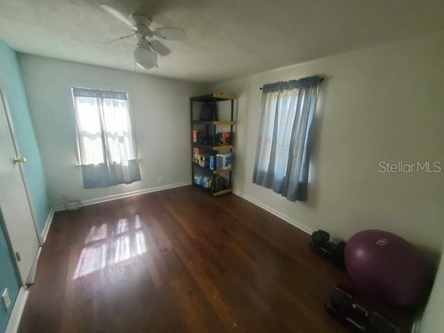 interior space featuring dark hardwood / wood-style floors and ceiling fan