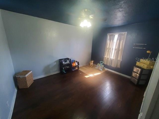 spare room featuring dark hardwood / wood-style flooring