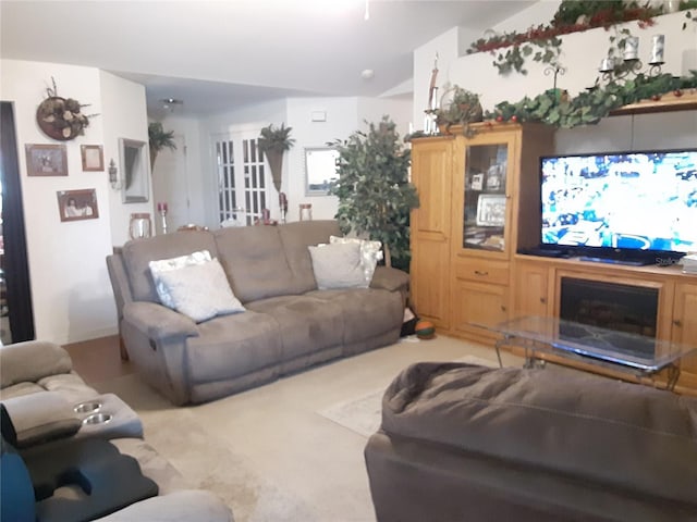 living room featuring lofted ceiling