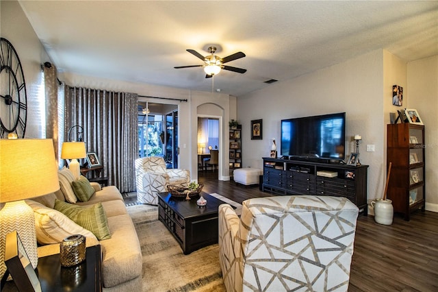 living room with ceiling fan, hardwood / wood-style floors, and a textured ceiling