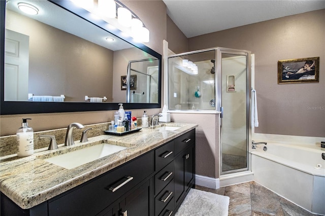 bathroom featuring vanity and independent shower and bath