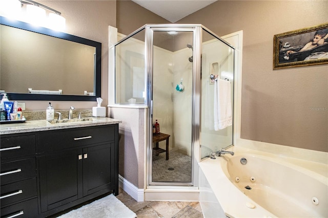 bathroom with vanity and independent shower and bath