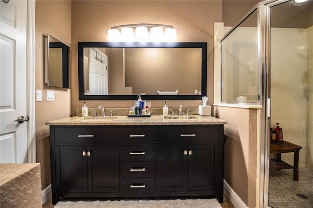 bathroom with vanity and an enclosed shower