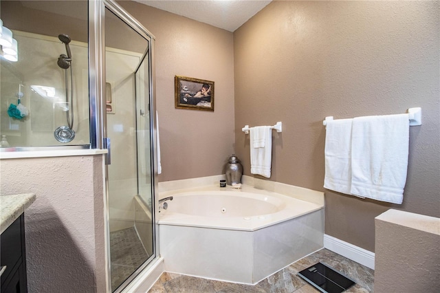 bathroom with vanity and separate shower and tub