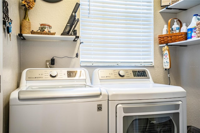 washroom with independent washer and dryer