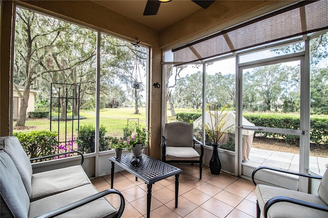 sunroom / solarium with ceiling fan