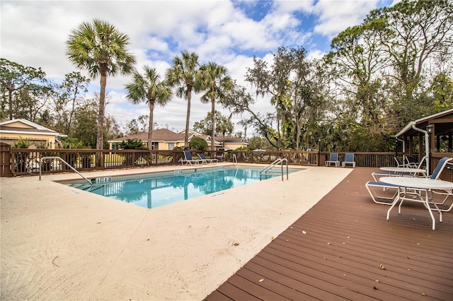 view of swimming pool featuring a deck