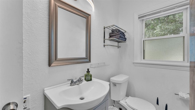 bathroom featuring toilet and sink