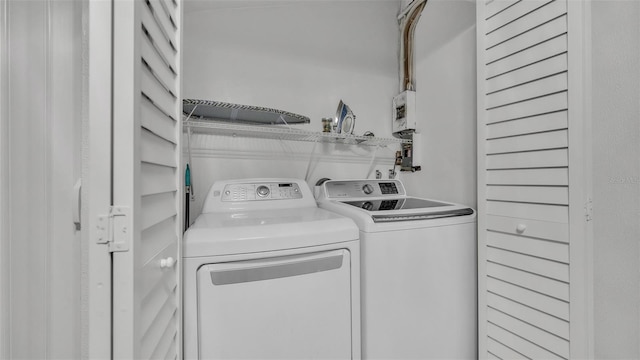 washroom with separate washer and dryer