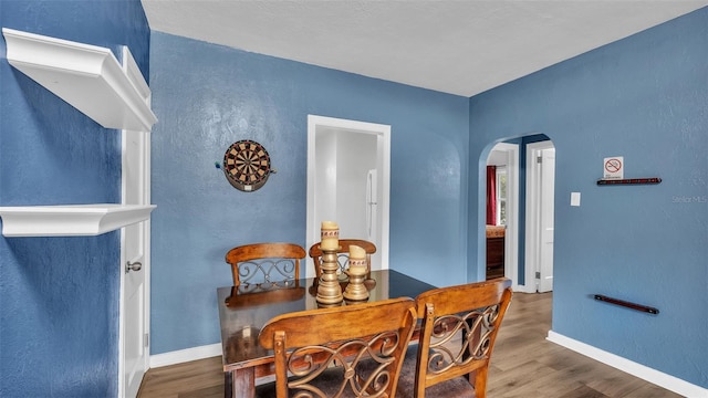 dining area with hardwood / wood-style floors