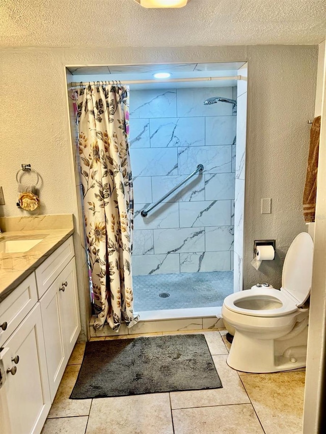 bathroom featuring a shower with curtain, tile patterned flooring, a textured ceiling, toilet, and vanity