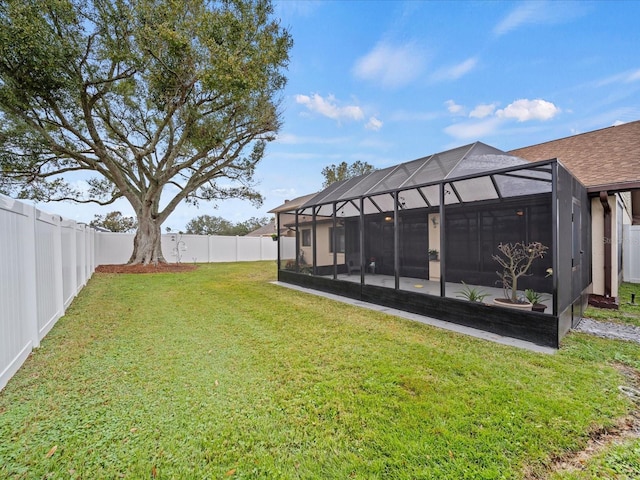 view of yard featuring a lanai