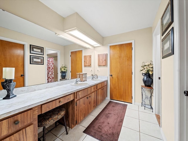 bathroom featuring tile patterned flooring and vanity