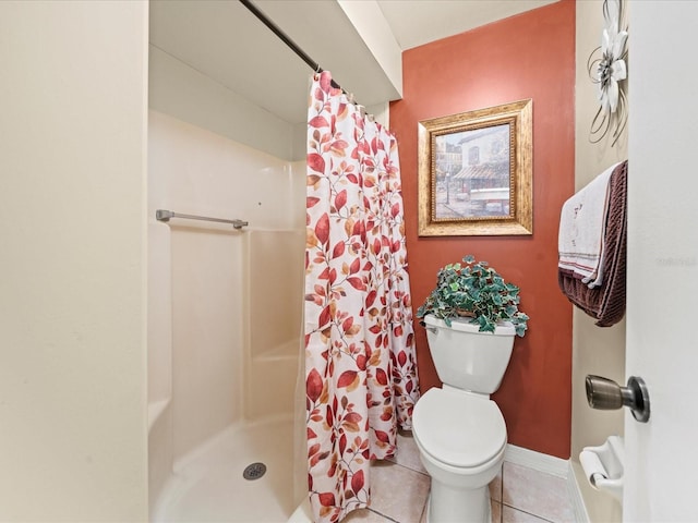 bathroom featuring tile patterned flooring, toilet, and a shower with shower curtain