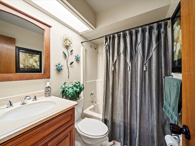 full bathroom with vanity, toilet, and shower / bath combo with shower curtain