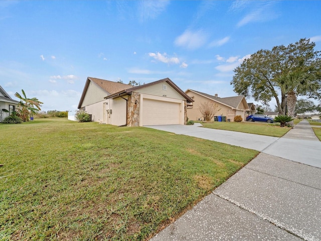 view of front of property featuring a front yard and a garage