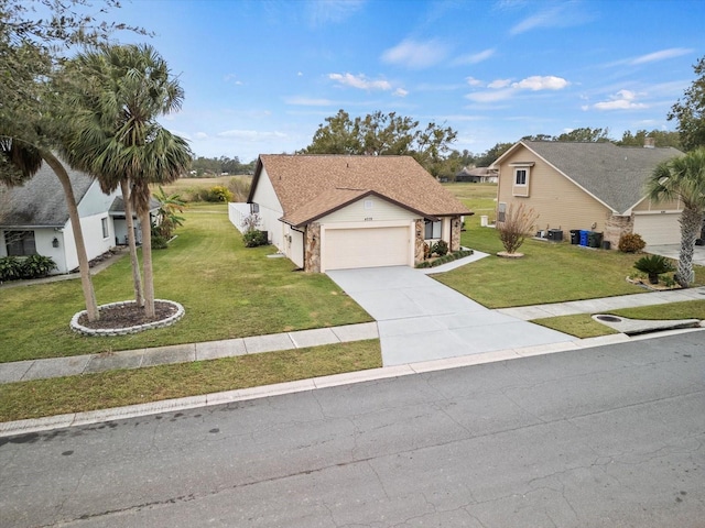 view of front of house featuring a front yard and a garage