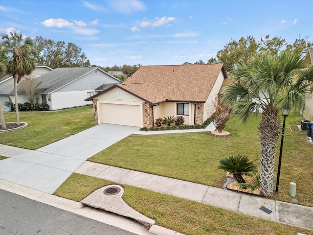 single story home with a front yard and a garage