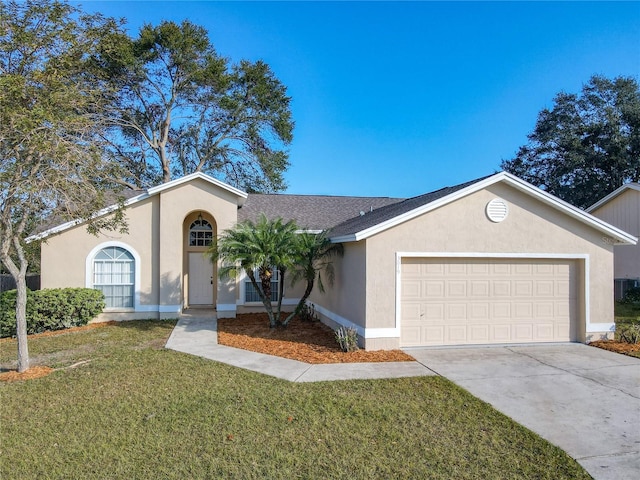 single story home with a garage and a front lawn