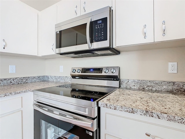 kitchen featuring white cabinets and stainless steel appliances